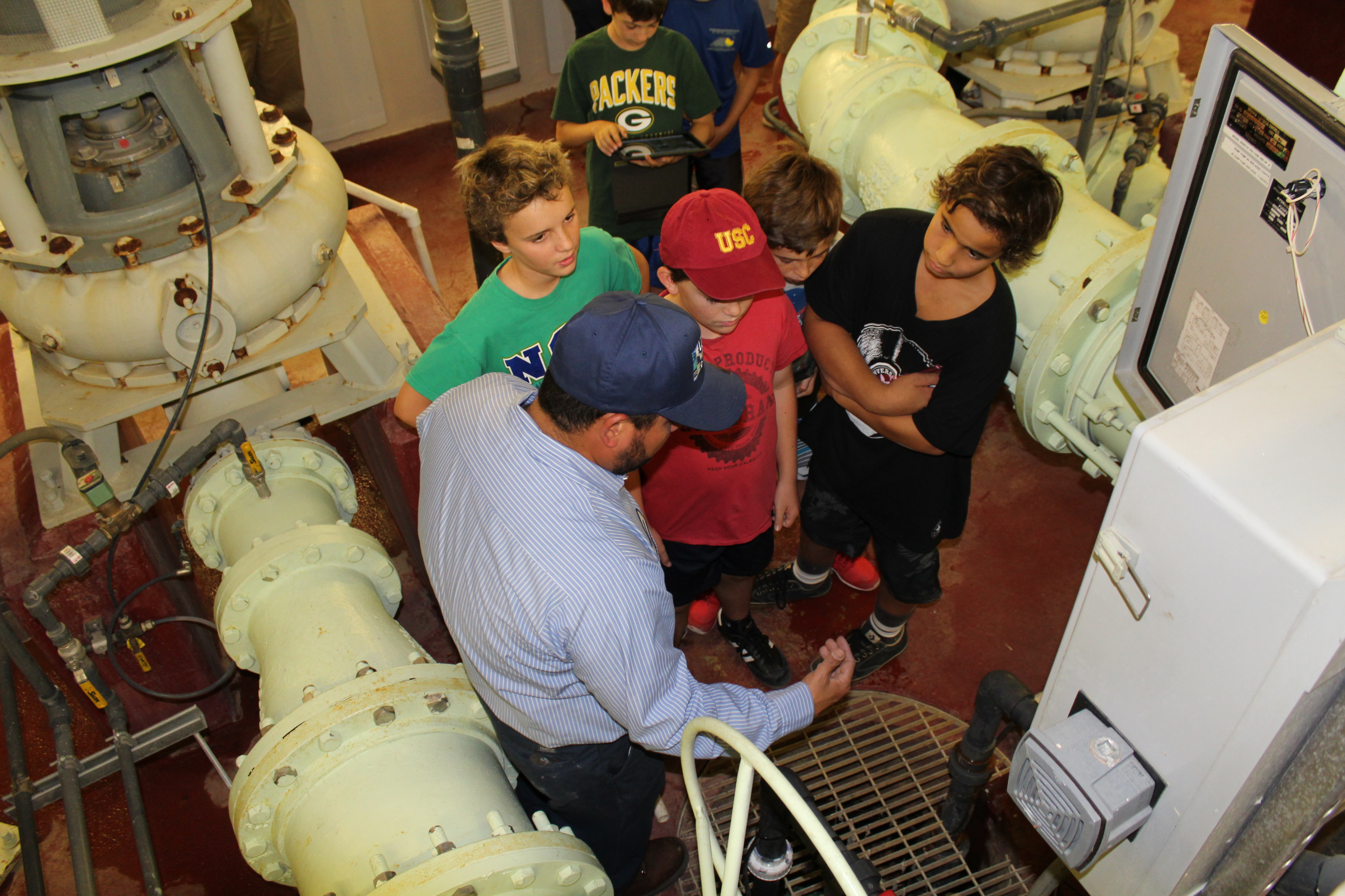 Students take a class tour inside Leucadia Pump Station.