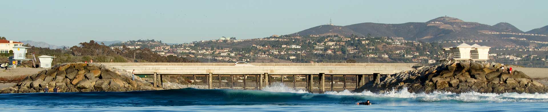 Small waves crashing under Batiquitos roadways