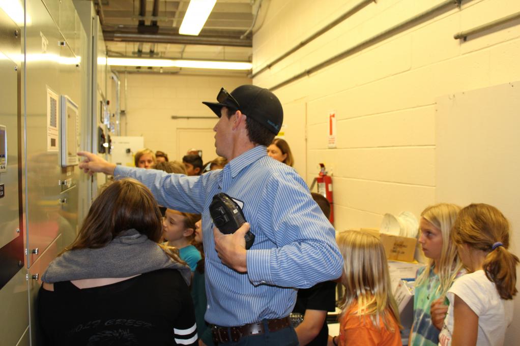 Students learn how the pumps inside a recycled water plant work.